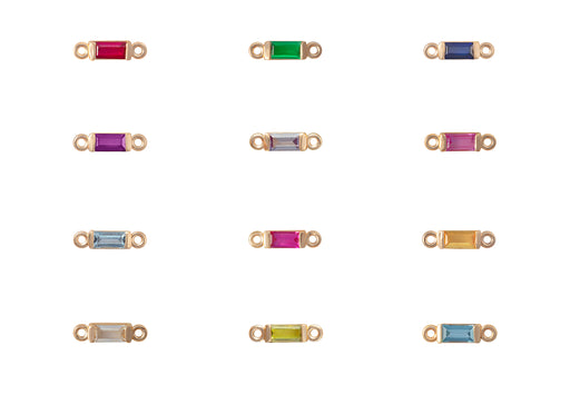 Gold jewelry connectors with colored gemstones on a white background