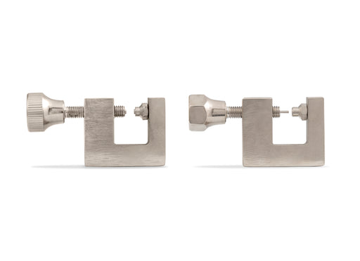 Two metal permanent jewelry hand tools on a white background
