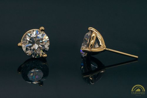 Photo of pair of 7.7mm Round 3-Prong Fairmined Gold Stud Earring Mountings from RIVA Precision