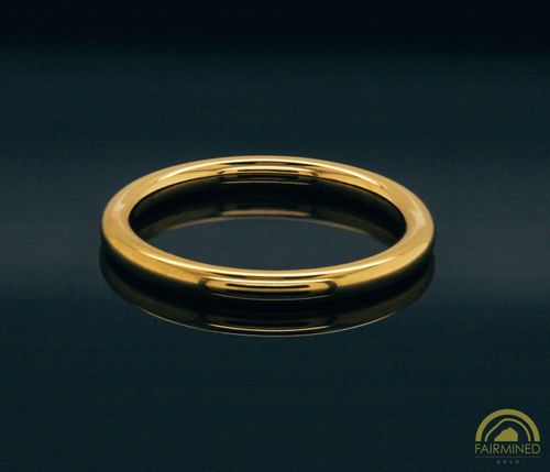 Photo of High-Polish Comfort Fit Wedding Band in Fairmined Yellow Gold from RIVA Precision