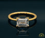 Photo of East-West Emerald Cut Diamond Solitaire Engagement Ring Mounting in Fairmined Yellow Gold from RIVA Precision
