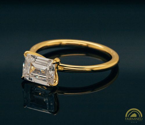 Alternate view of East-West Emerald Cut Diamond Solitaire Engagement Ring Mounting in Fairmined Yellow Gold from RIVA Precision