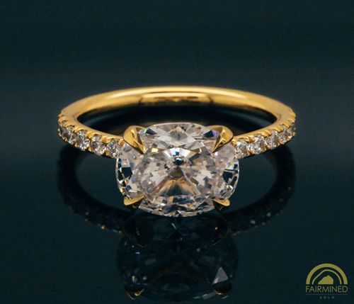 Photo of East-West Oval Diamond Pavé Engagement Ring Semi-Mount in Fairmined Yellow Gold from RIVA Precision