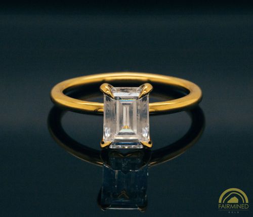 Photo of Emerald Cut Diamond Solitaire Engagement Ring Mounting in Fairmined Yellow Gold from RIVA Precision