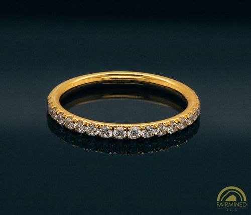 Photo of Half Pavé Comfort Fit Wedding Band in Fairmined Yellow Gold from RIVA Precision