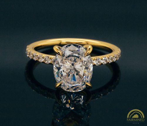 Photo of Oval Diamond Pavé Engagement Ring Semi-Mount in Fairmined Yellow Gold from RIVA Precision