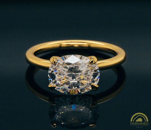 Photo of East-West Oval Diamond Solitaire Engagement Ring Mounting in Fairmined Yellow Gold from RIVA Precision