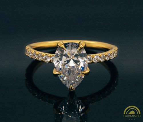 Photo of Pear-Shaped Diamond Pavé Engagement Ring Semi-Mount in Fairmined Yellow Gold from RIVA Precision