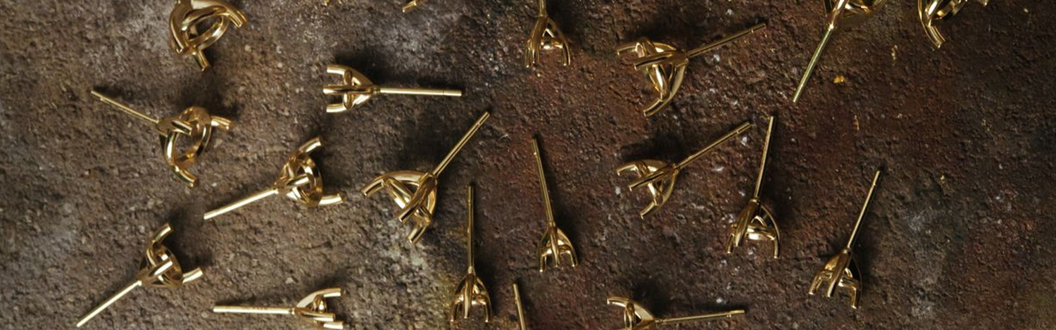 Fairmined Gold Stud Earrings scattered on table