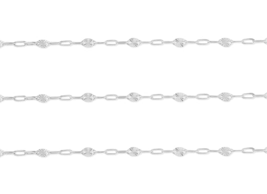 A close-up image of a sterling silver chain with a repeating pattern of paperclip links and hammered starburst links.