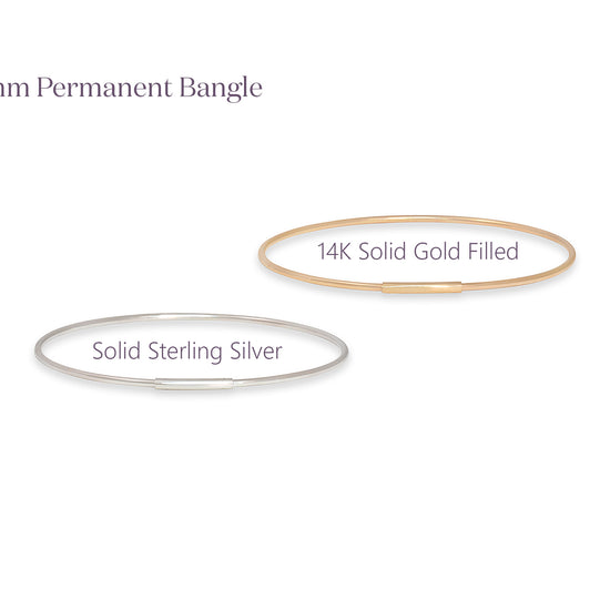 Two bangles labeled '14K Solid Gold Filled' and 'Solid Sterling Silver' on a white background.