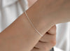 Silver bracelet on a wrist with a blurred background