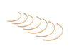 Set of gold hoop earrings on a white background