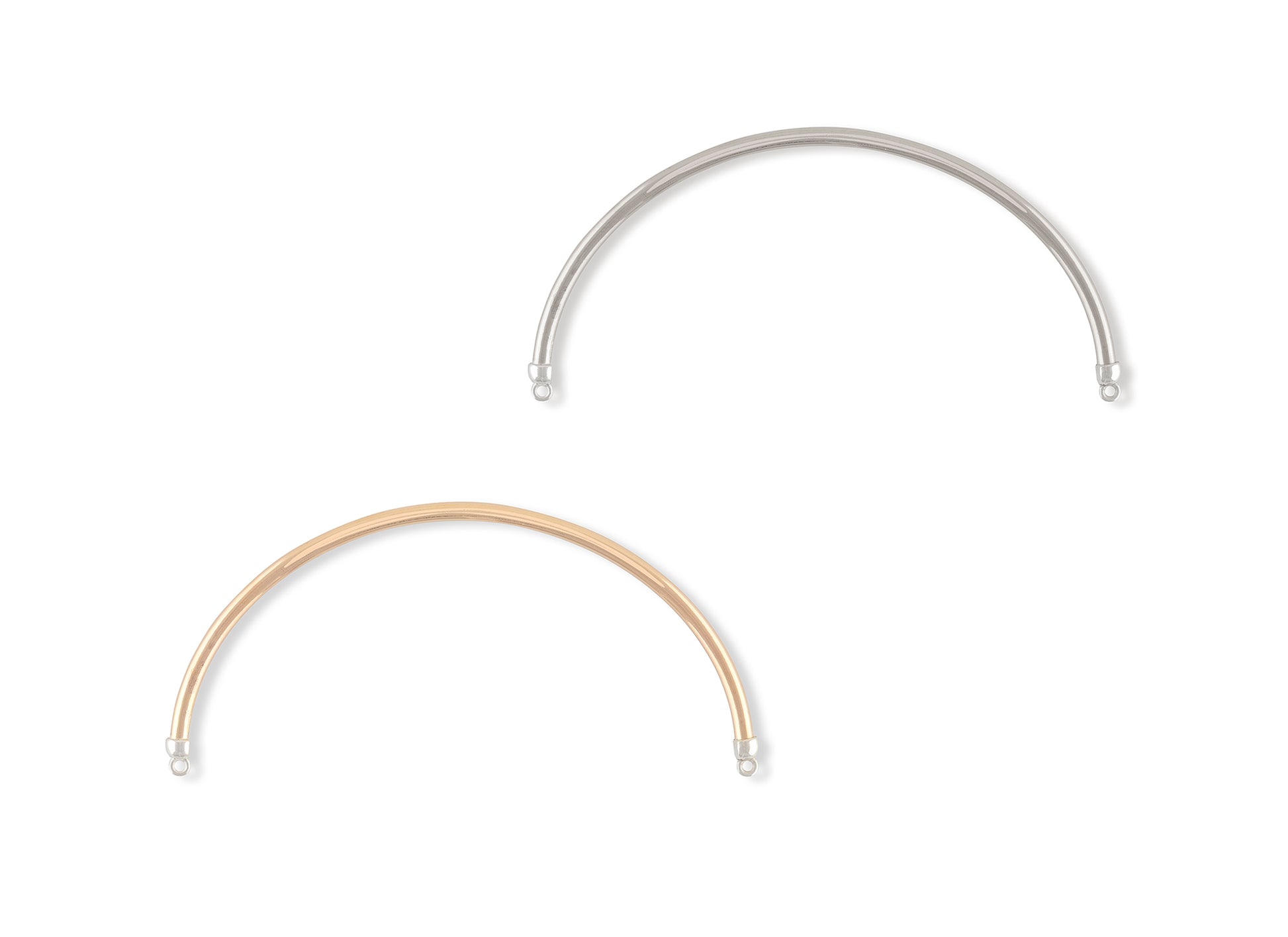 Two gold and silver half cuff bracelets on a white background