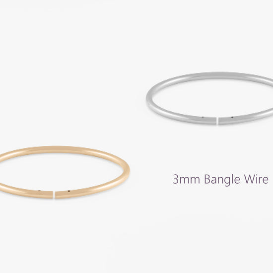 Gold and silver 3mm bangle wires on a white background