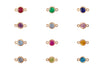 Gold jewelry connectors with colorful gemstones on a white background