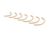 Set of gold hoop earrings on a white background