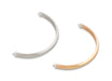 Two necklaces, one white and one beige, on a white background