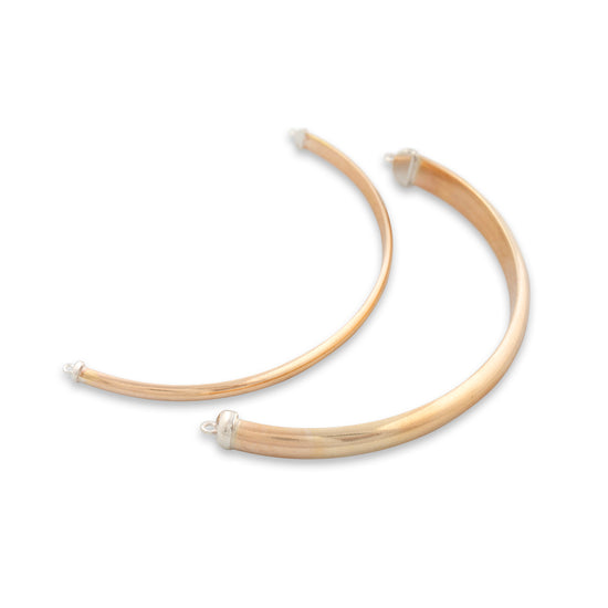 Gold hoop earrings on a white background