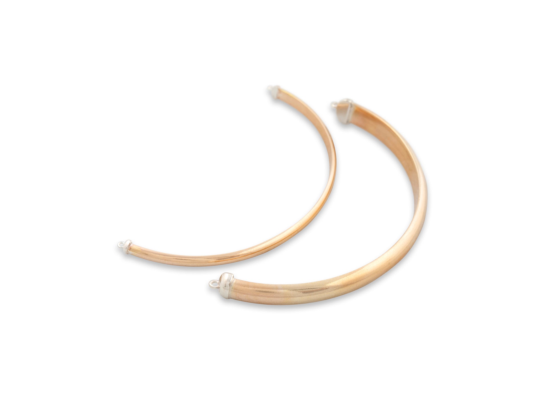 Gold hoop earrings on a white background