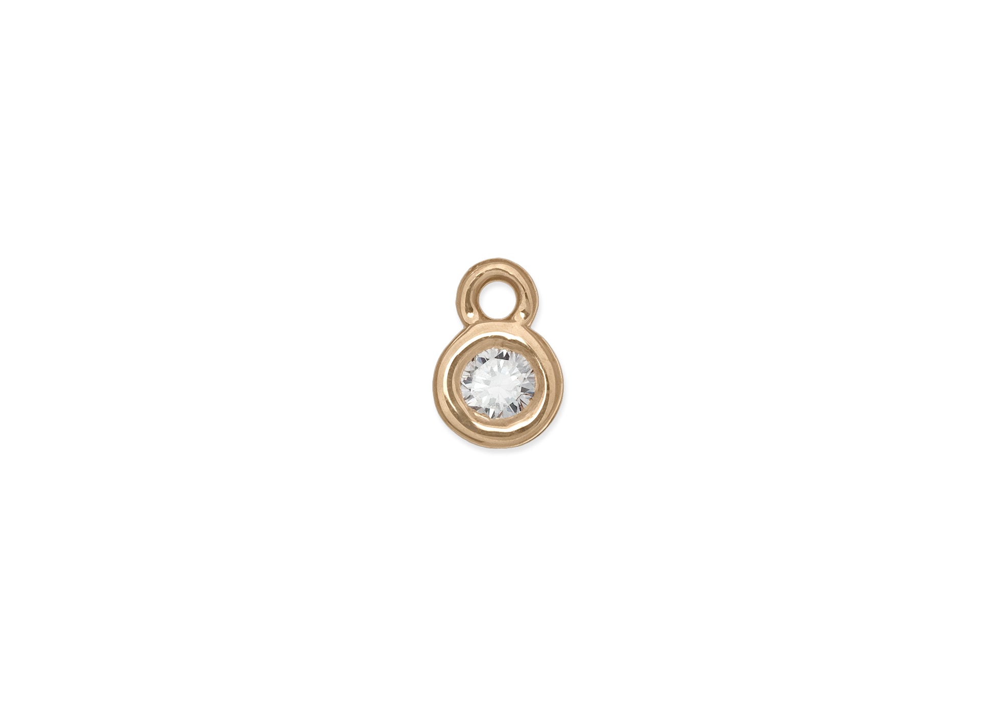 A bezel-set birthstone charm 14k gold and a clear gemstone.