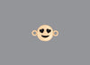 Round emoji connector in gold with a smile engraving on gray background