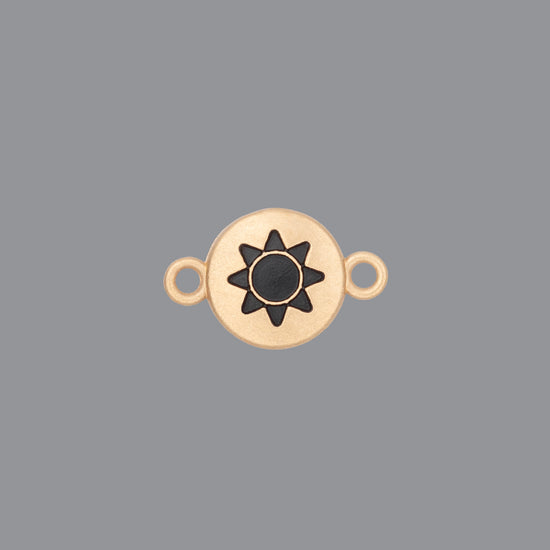 Round emoji connector in gold with a sun engraving on gray background