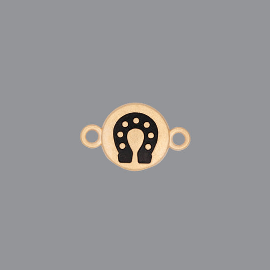 Round emoji connector in gold with a horseshoe engraving on gray background