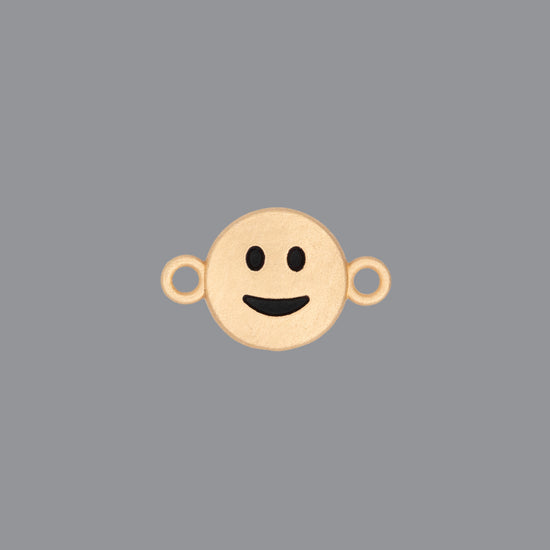 Round emoji connector in gold with a smile engraving on gray background