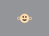 Round emoji connector in gold with a smile engraving on gray background