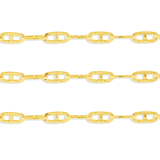 A close-up image of a textured gold mariner chain with a focus on the metallic texture and color.