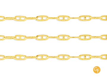 A close-up image of a textured gold mariner chain with a focus on the metallic texture and color.
