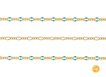 A gold-filled chain with mixed link enamel, featuring blue and white colored links, by the inch.