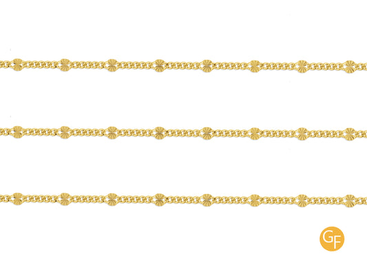 A gold-filled starburst cable chain with hammer textured links on a white background.