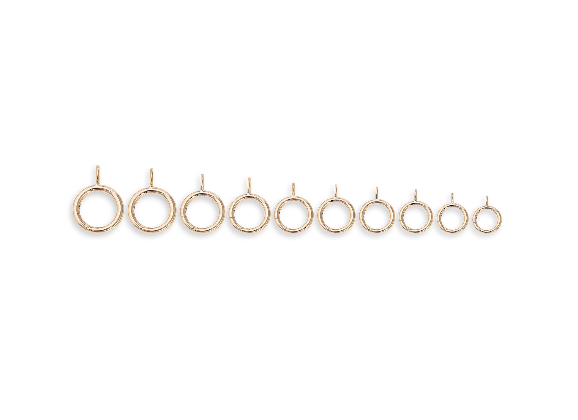 Set of gold invisible clasps on a white background