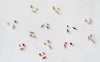 Small birthstone connectors with gemstones on a white background