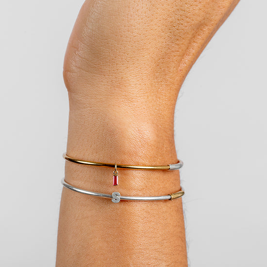 Permanent Bangle with red baguette charm and silver letter