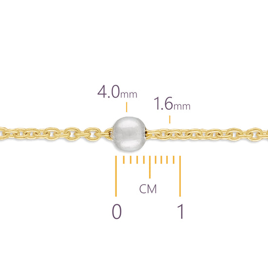 Gold chain with a pearl and measurement scale on a white background