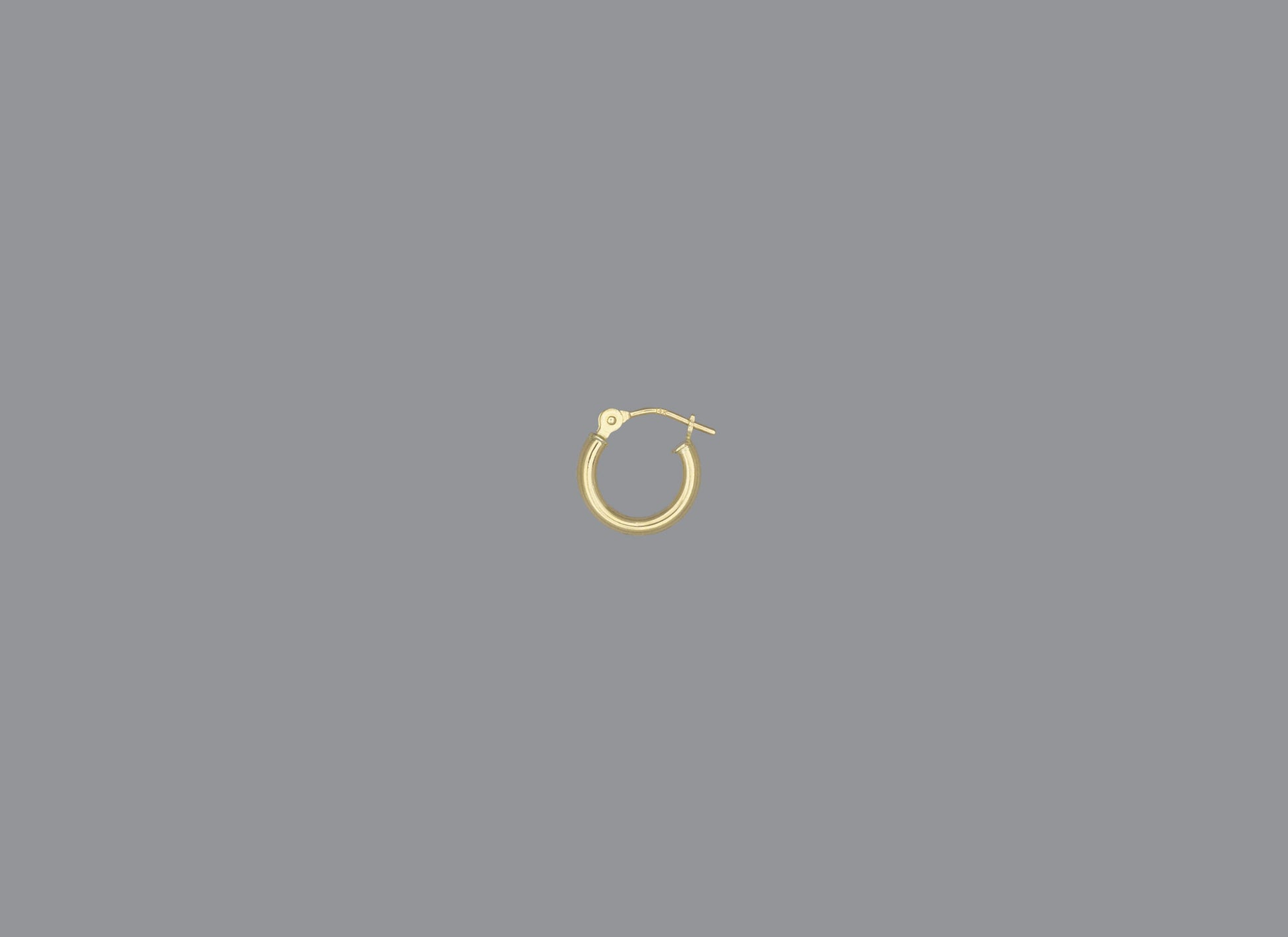 A hoop earring made of 14KY gold, displayed against a grey background.