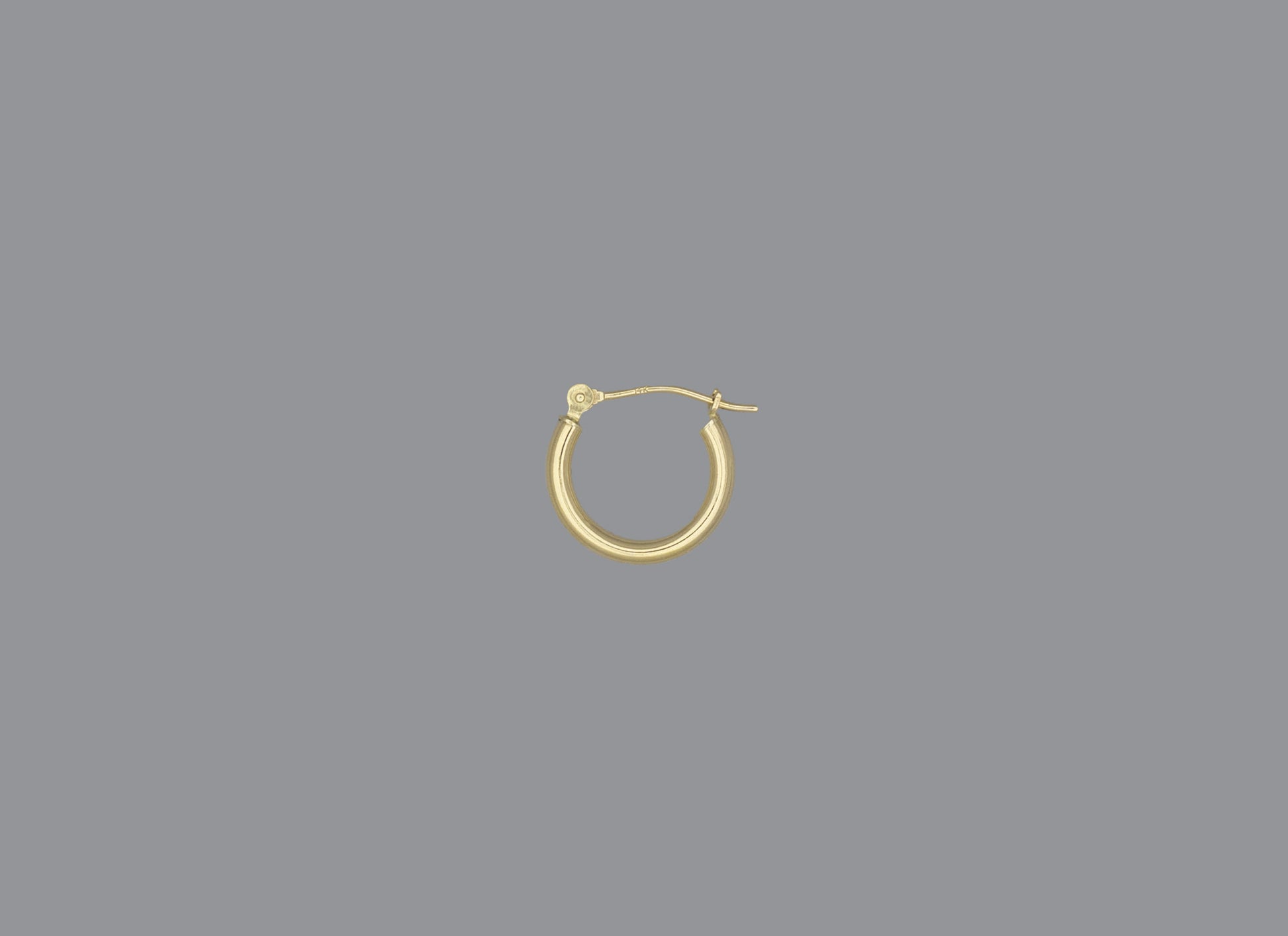 A hoop earring made of 14KY gold, displayed against a grey background.