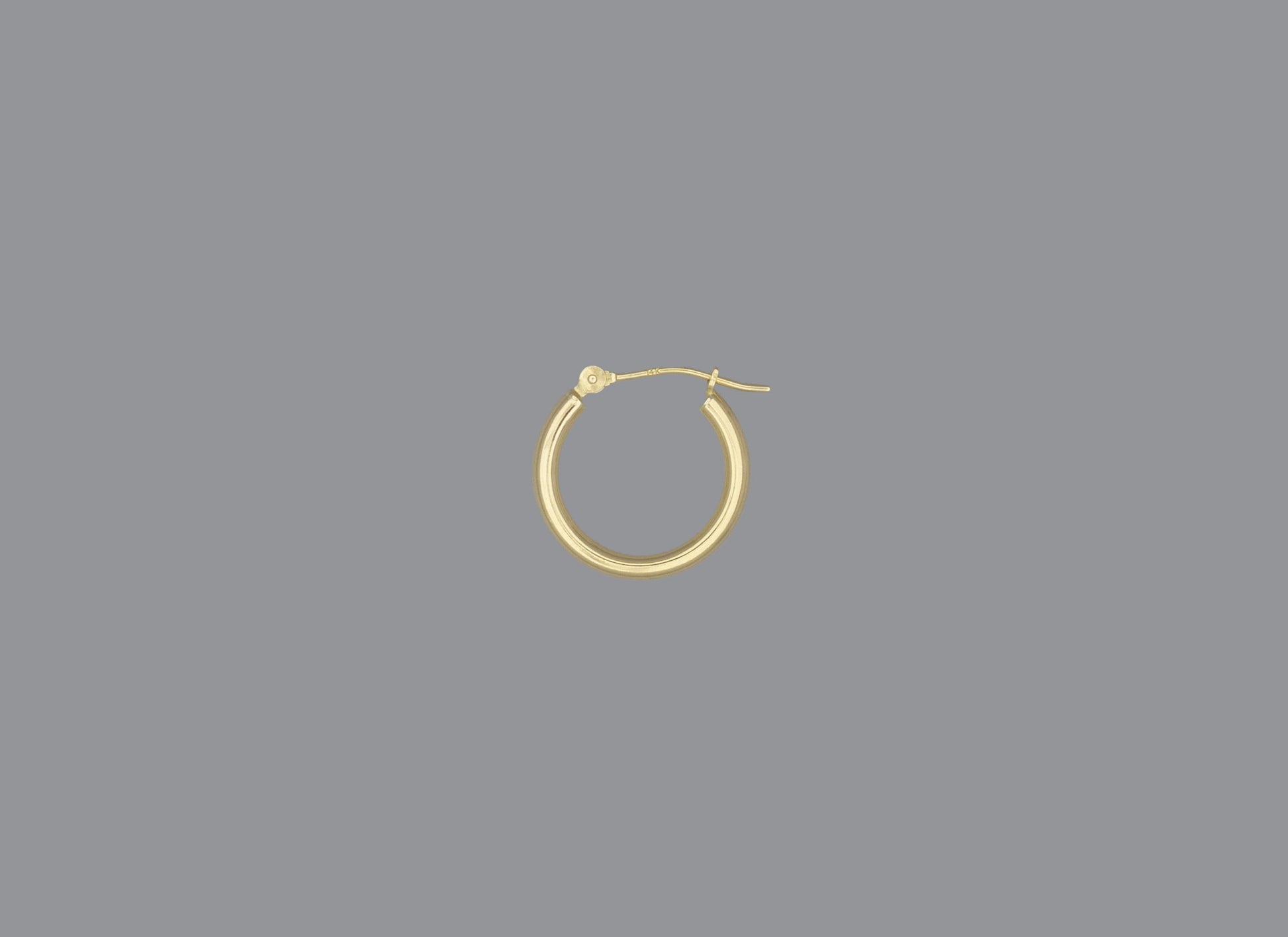 A hoop earring made of 14KY gold, displayed against a grey background.