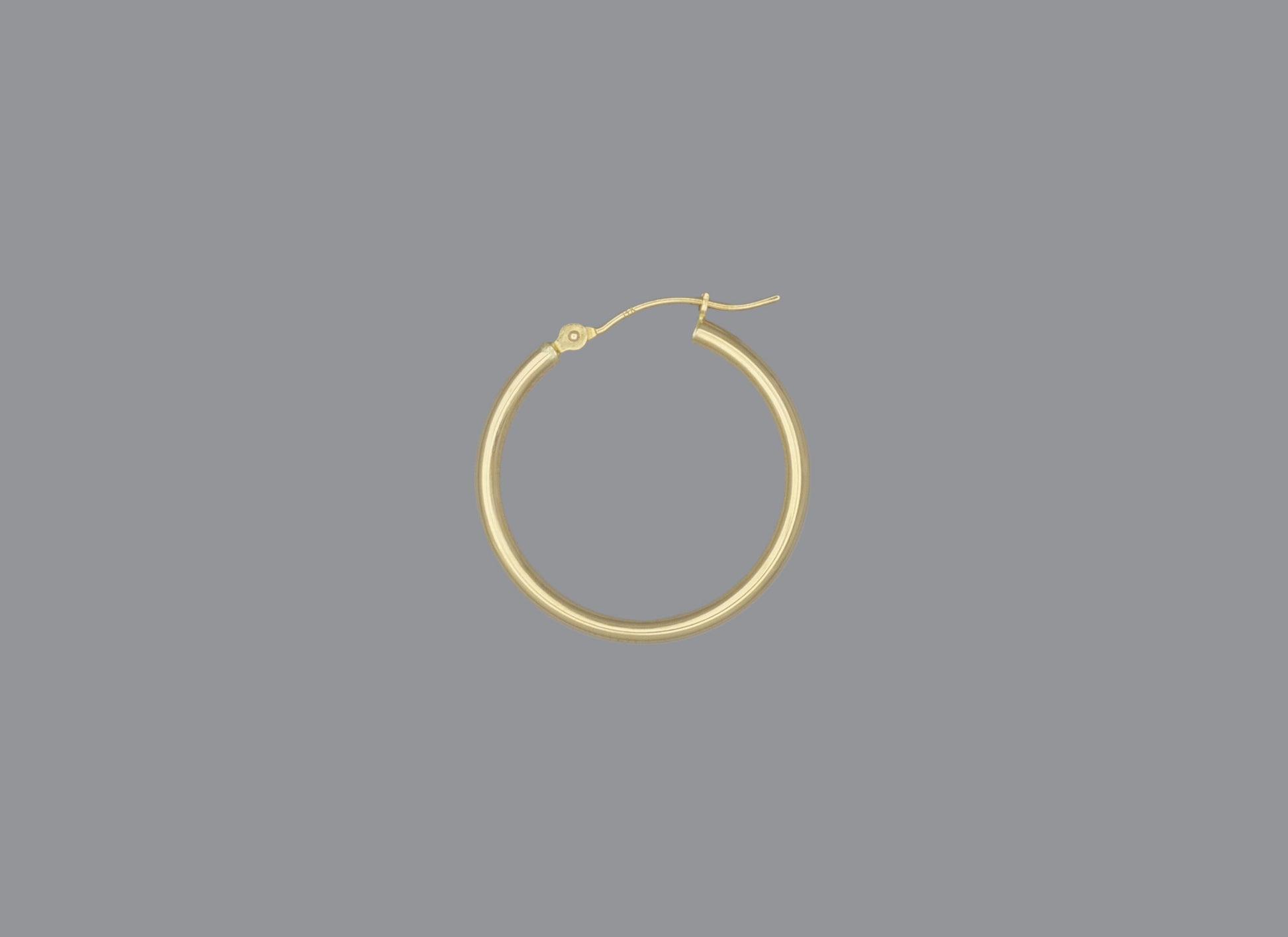 A hoop earring made of 14KY gold, displayed against a grey background.