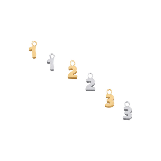 A collection of number charms in two different colors, displayed in a numerical order.