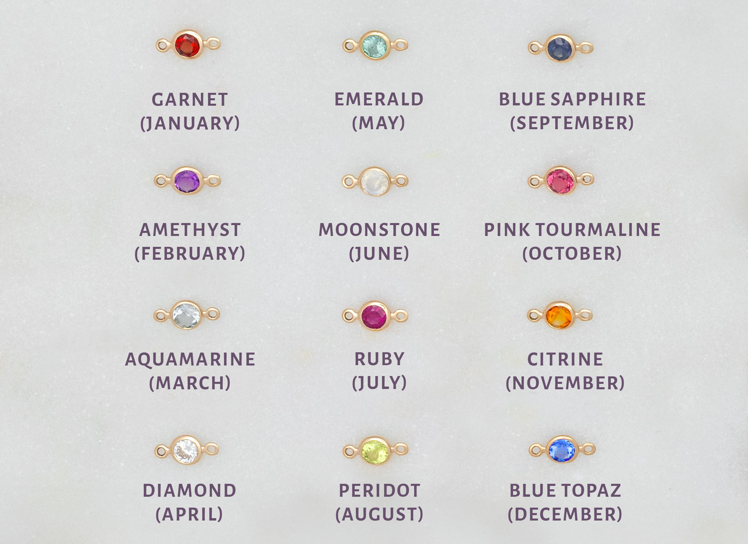 A collection of bezel-set birthstone connectors in various colors corresponding to different months, made of 14K gold.
