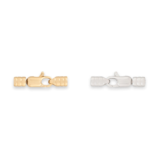 Gold and silver clasp connectors on a white background