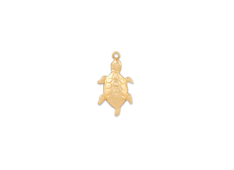 Gold turtle pendant on a white background