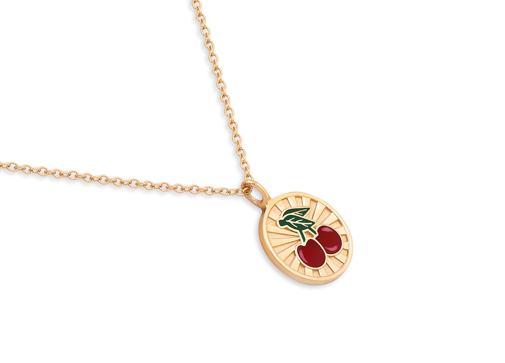 Gold necklace with a cherry pendant on a white background