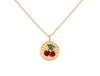 Gold necklace with a cherry pendant on a white background