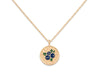 Gold necklace with a circular pendant featuring blueberries on a white background