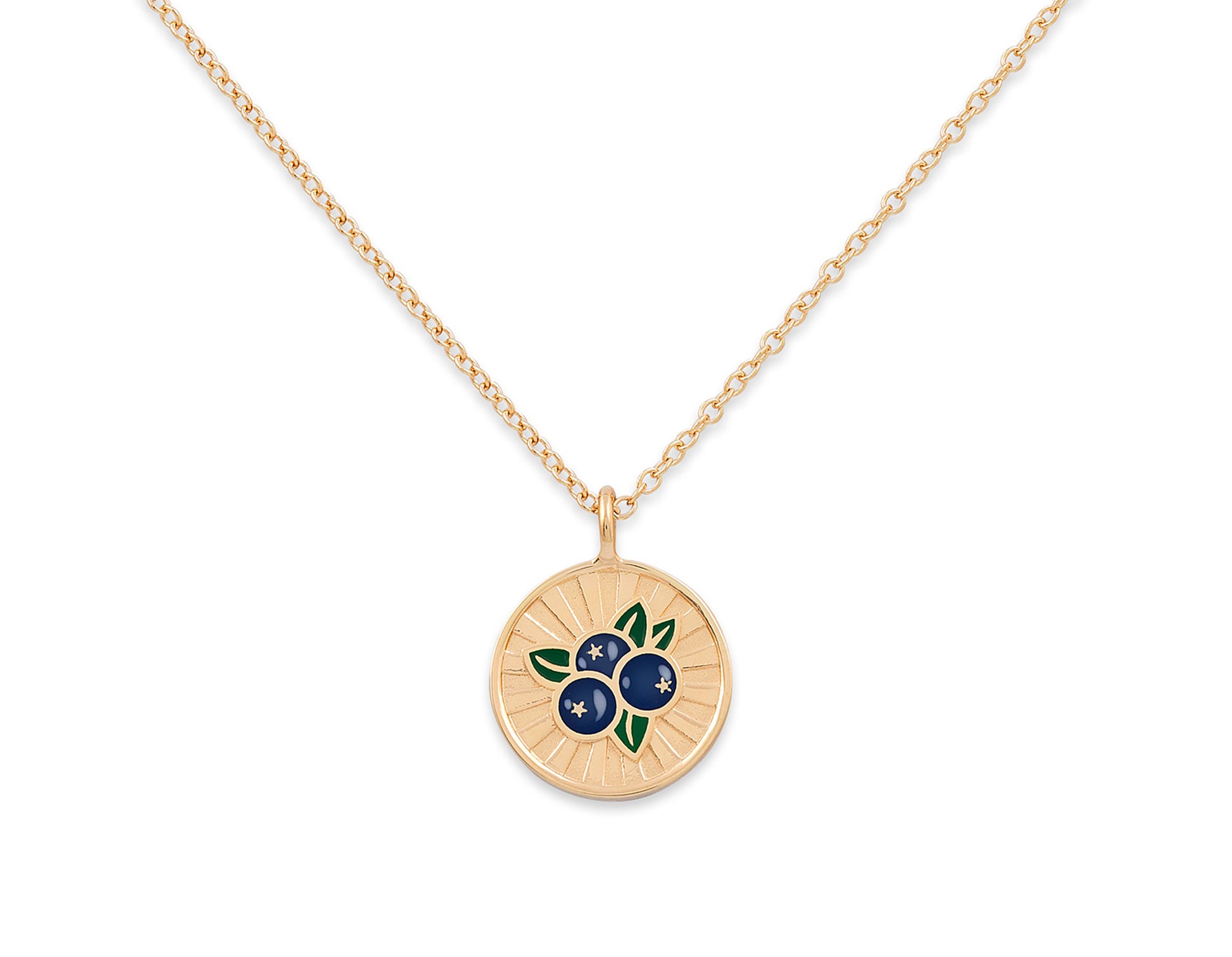 Gold necklace with a circular pendant featuring blueberries on a white background